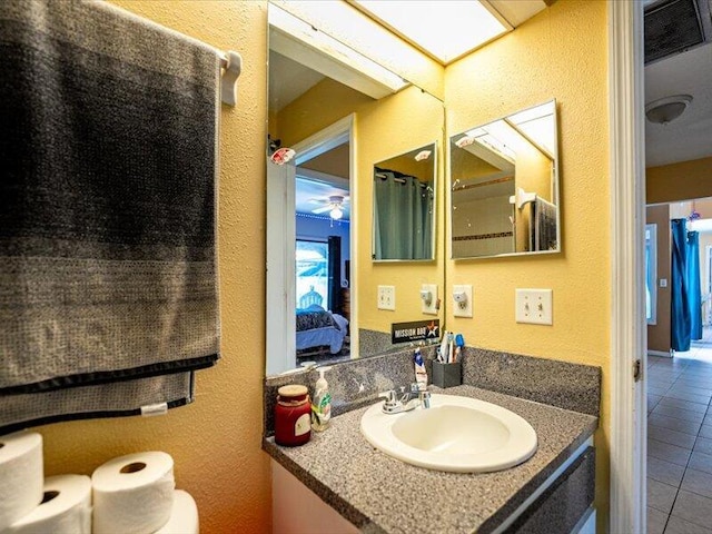 bathroom with vanity and tile patterned floors