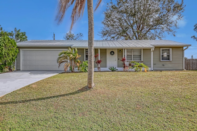 single story home with a garage and a front lawn