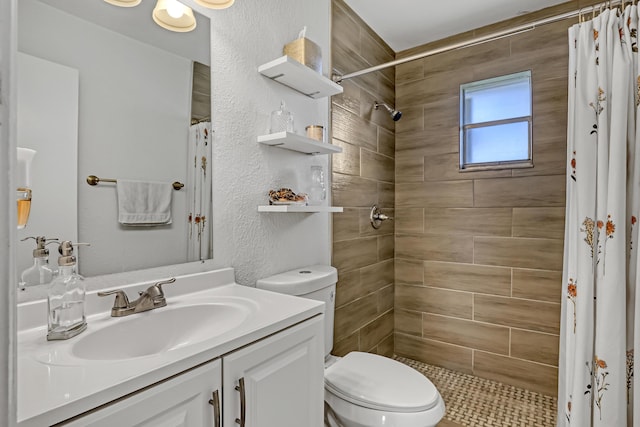 bathroom featuring vanity, curtained shower, and toilet