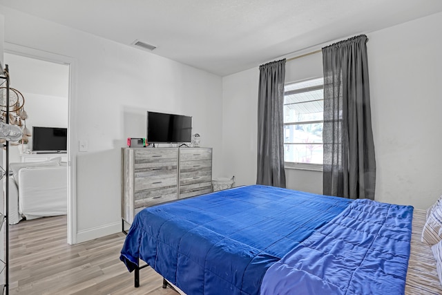 bedroom featuring hardwood / wood-style flooring