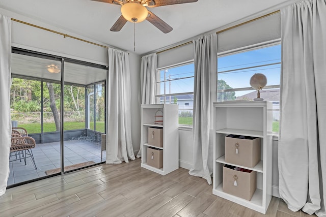 interior space featuring ceiling fan