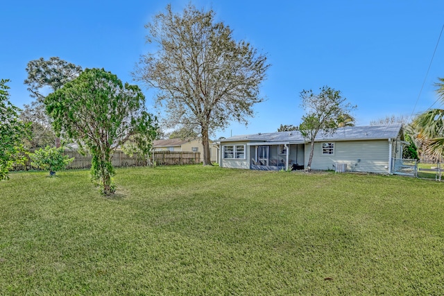 view of yard featuring a sunroom