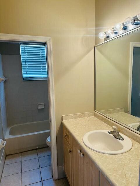 bathroom with vanity, toilet, and tile patterned floors