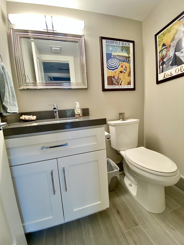 bathroom with vanity and toilet