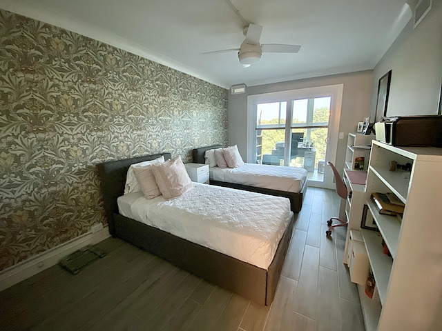 bedroom featuring hardwood / wood-style floors and ceiling fan