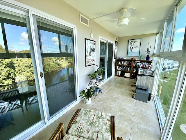 sunroom / solarium with ceiling fan and a wealth of natural light