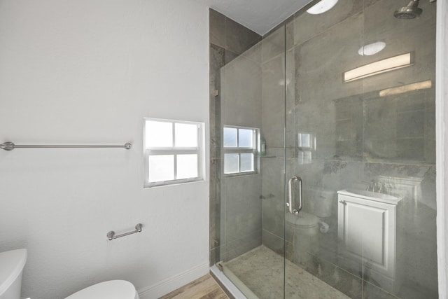331 NW 1st Ave, Boynton Beach, FL 33435 - bathroom with hardwood / wood-style flooring, toilet, and a shower with door