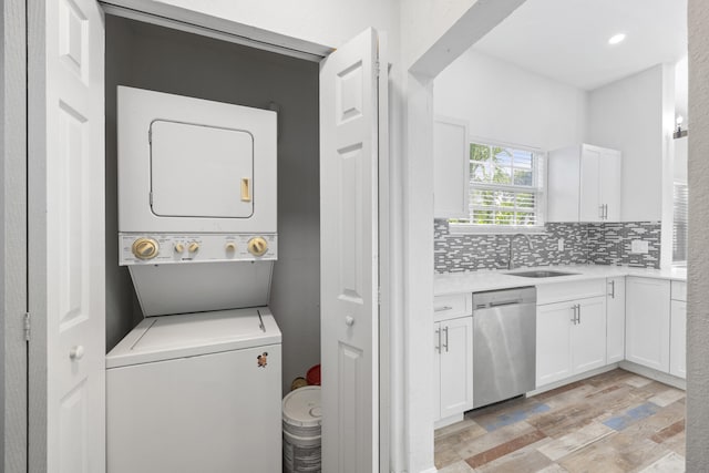 331 NW 1st Ave, Boynton Beach, FL 33435 - laundry room with stacked washer / drying machine and sink