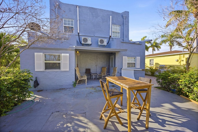 331 NW 1st Ave, Boynton Beach, FL 33435 - back of property with ac unit and a patio area