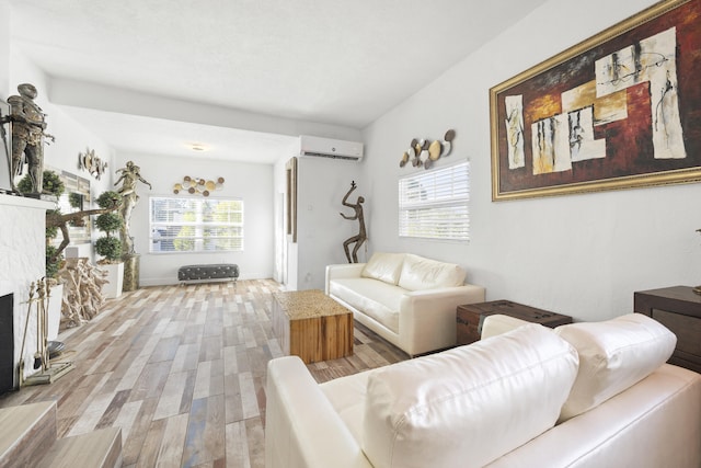 331 NW 1st Ave, Boynton Beach, FL 33435 - living room with a wall mounted air conditioner and light hardwood / wood-style floors