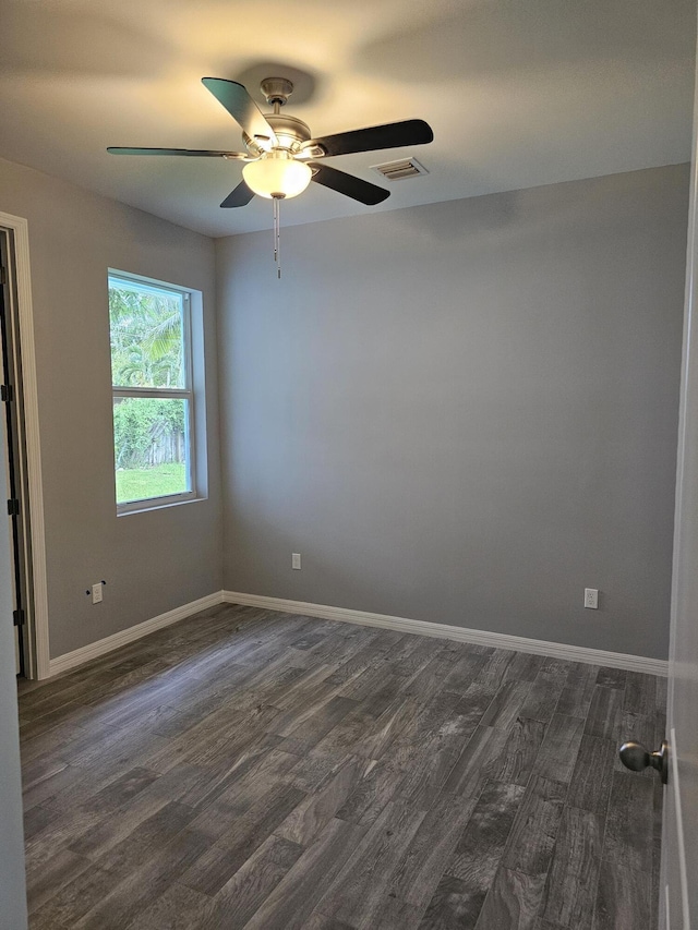 unfurnished room featuring dark hardwood / wood-style flooring and ceiling fan