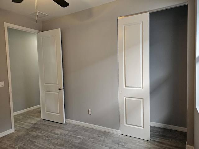 unfurnished bedroom with wood-type flooring and ceiling fan