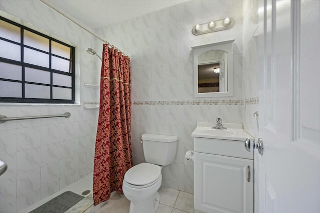 bathroom featuring vanity, tile walls, and walk in shower