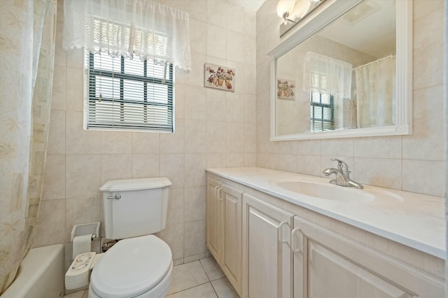 full bathroom with shower / bathtub combination with curtain, tile walls, vanity, tile patterned floors, and toilet