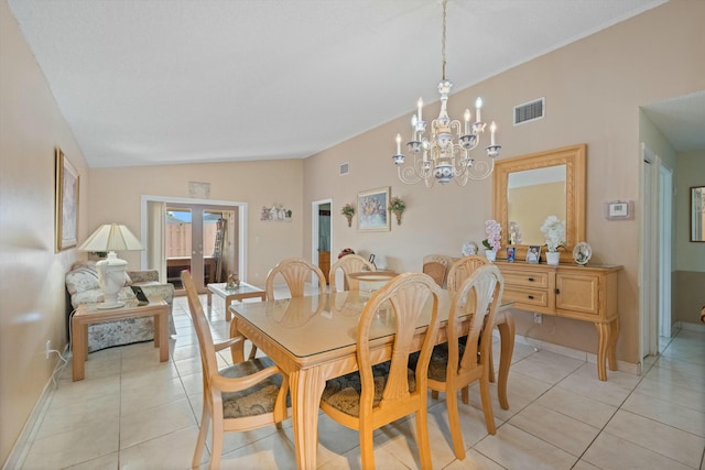 dining area featuring french doors, lofted ceiling, light tile patterned flooring, and a chandelier