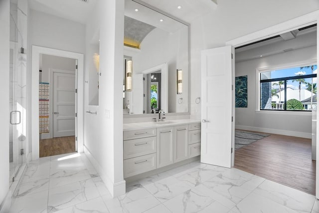 bathroom with vanity and an enclosed shower