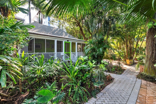 view of yard featuring a sunroom