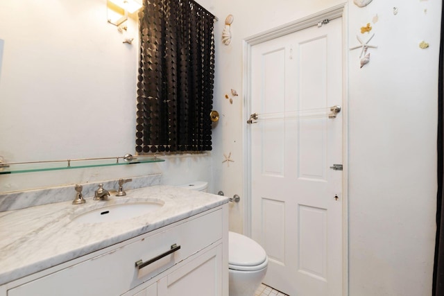 bathroom with vanity and toilet