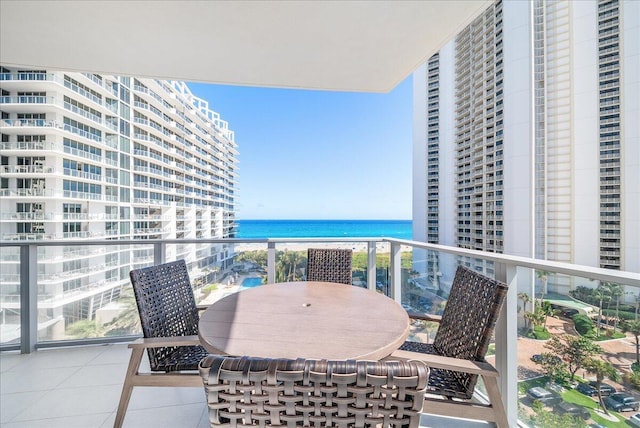 balcony featuring a water view