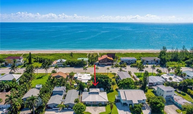 drone / aerial view with a view of the beach and a water view