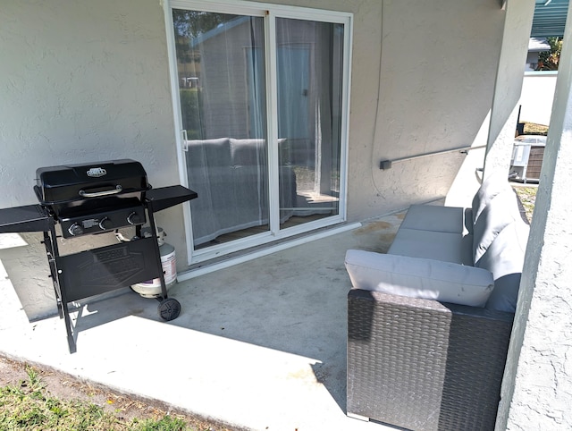 view of patio / terrace with area for grilling and central AC