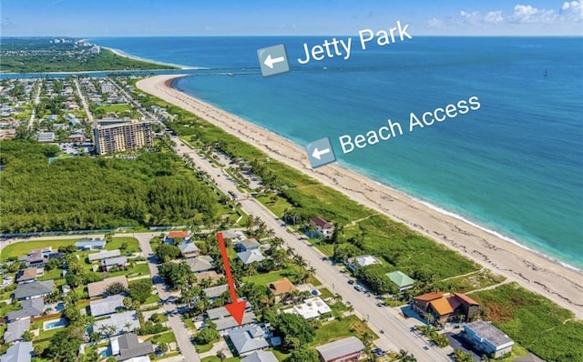 aerial view with a water view and a view of the beach