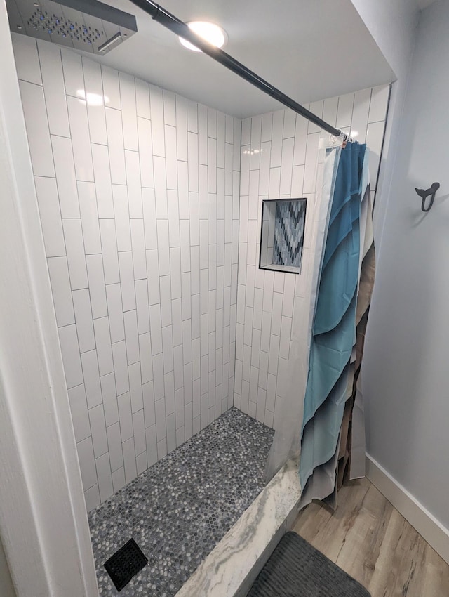 bathroom featuring a shower with curtain and wood-type flooring