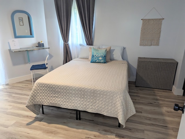 bedroom featuring hardwood / wood-style flooring