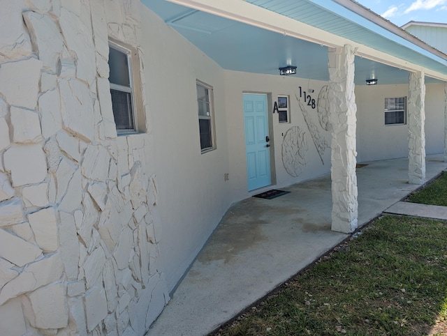 entrance to property with a patio