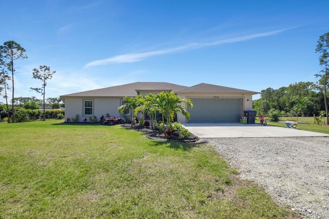 single story home with a garage and a front lawn