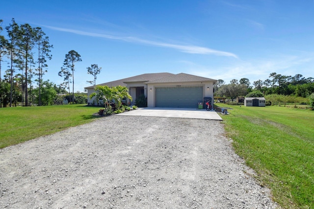 view of front of home with a garage and a front yard