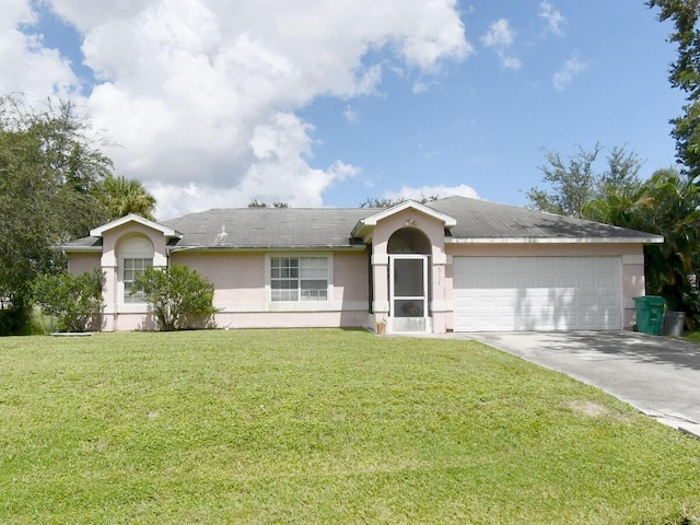 ranch-style home featuring a garage and a front yard