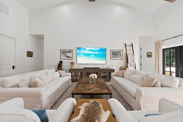 living room featuring high vaulted ceiling