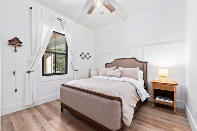 bedroom featuring hardwood / wood-style floors and ceiling fan