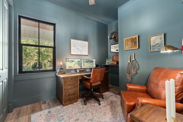 office area with light hardwood / wood-style floors