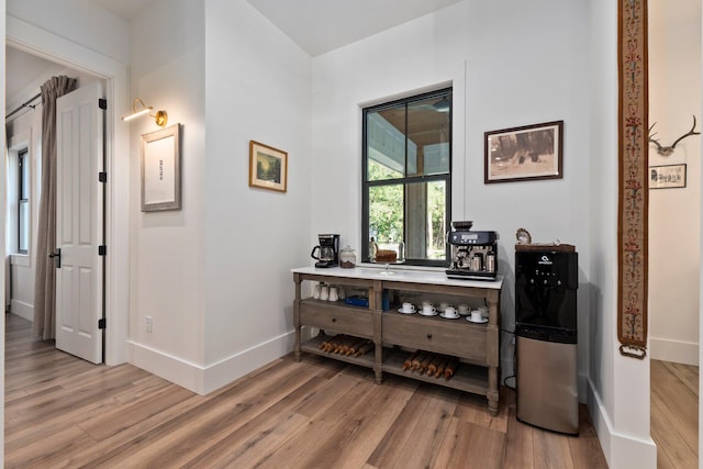 hall with hardwood / wood-style floors