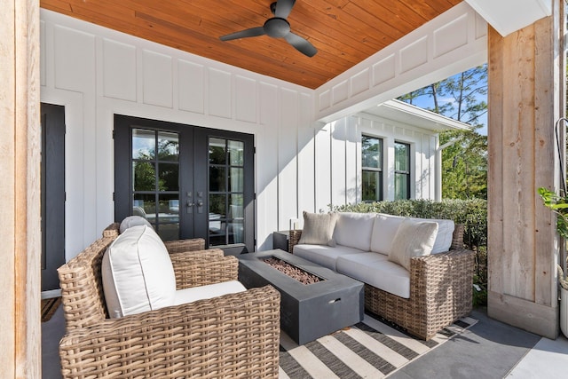 sunroom / solarium featuring vaulted ceiling, wooden ceiling, french doors, and ceiling fan