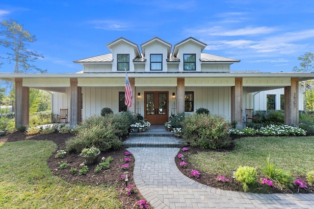 view of front of house featuring a porch and a front lawn