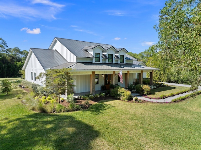 view of front of house with covered porch and a front yard