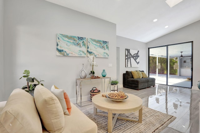 living room with lofted ceiling with skylight