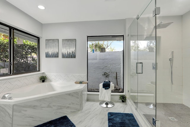 bathroom featuring plus walk in shower