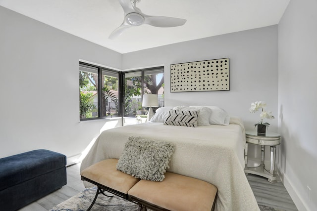 bedroom with ceiling fan and light wood-type flooring