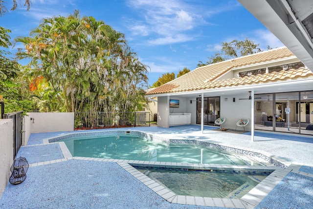 view of pool with ceiling fan and a patio