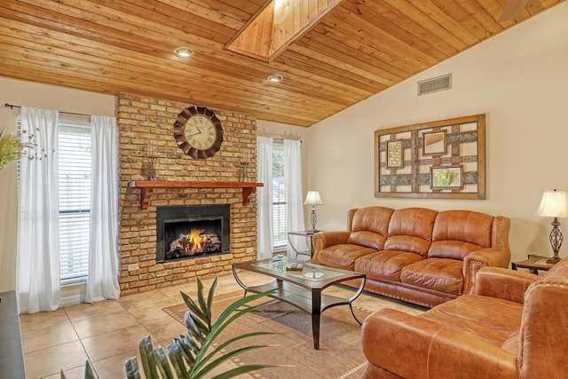 living area featuring a healthy amount of sunlight, wood ceiling, visible vents, and light tile patterned flooring