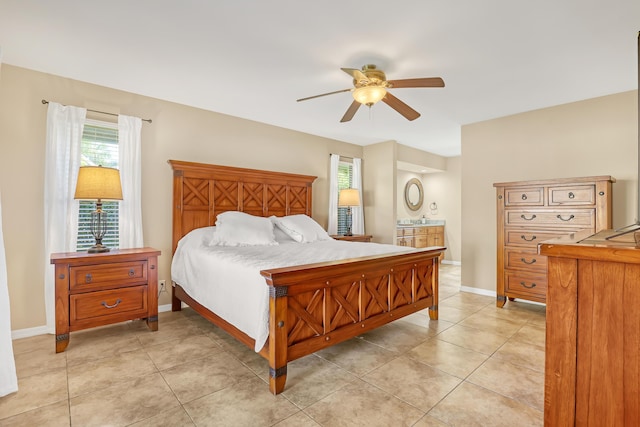 bedroom featuring light tile patterned floors, ceiling fan, and baseboards