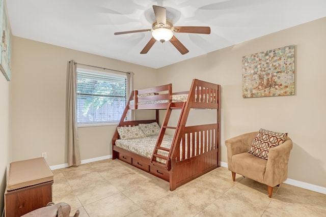 bedroom featuring ceiling fan, baseboards, and light tile patterned floors