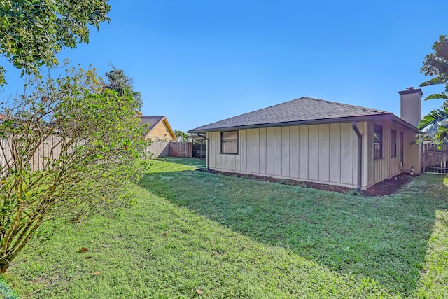 exterior space with a fenced backyard