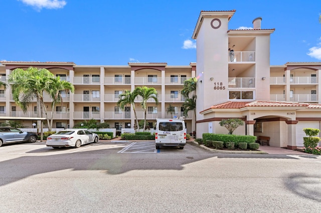 view of property with uncovered parking