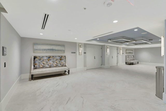 interior space with a tray ceiling