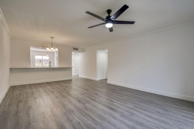 7281 Amberly Ln Unit 306, Delray Beach, FL 33446 - unfurnished living room featuring ornamental molding, a chandelier, ceiling fan, dark wood-style floors, and baseboards